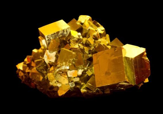 Pieces of pyrite or fool's gold on a black background.