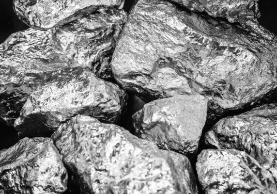 Pieces of palladium on a black background.